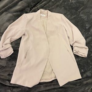 Blazer with shoulder pads and cinched sleeves